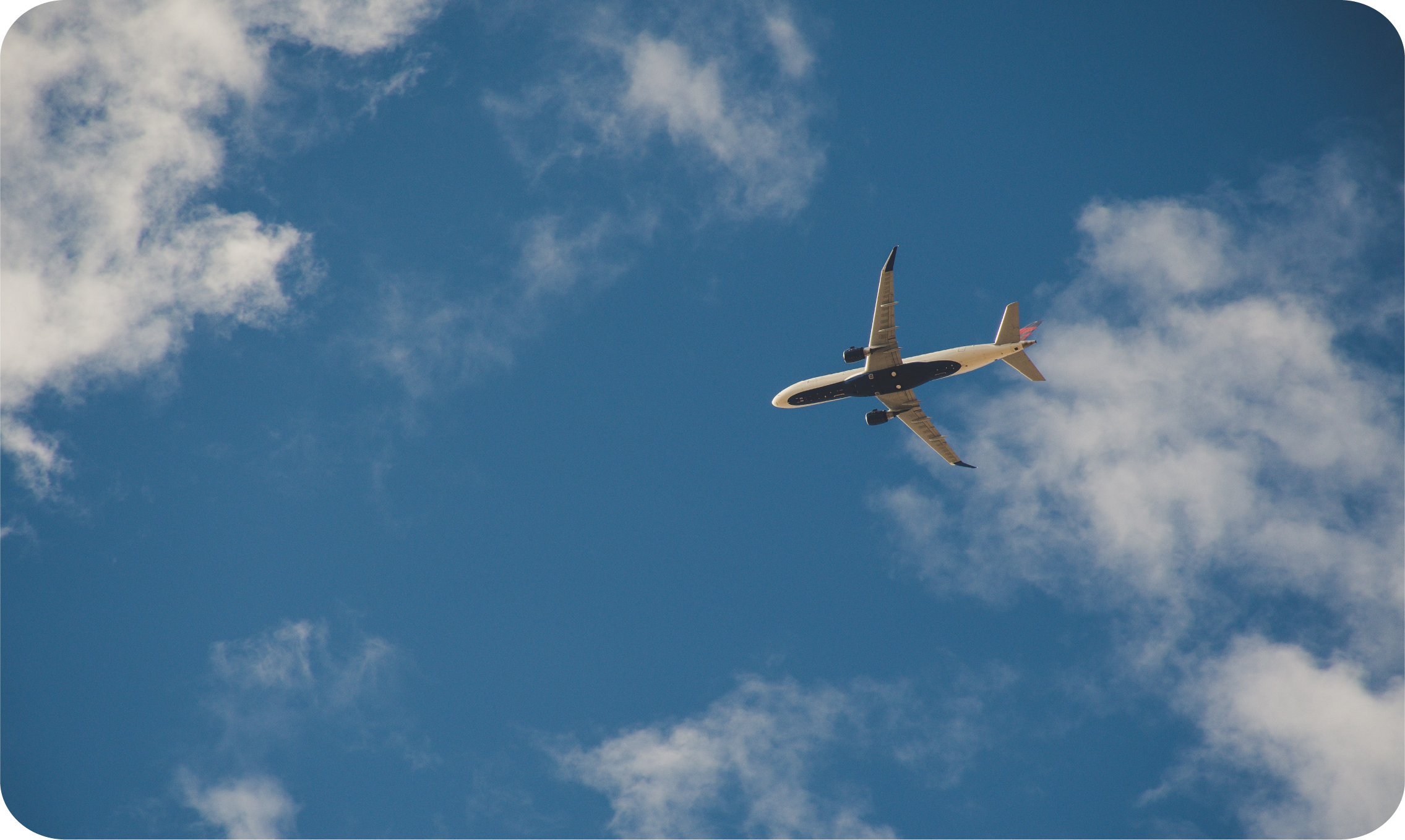 Plane overhead in blue sky